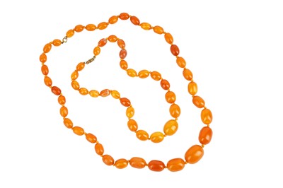 Lot 61 - TWO AMBER BEAD NECKLACES