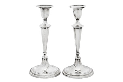 Lot 122 - A pair of Edwardian sterling silver candlesticks, Sheffield 1909 by Elkington and Co