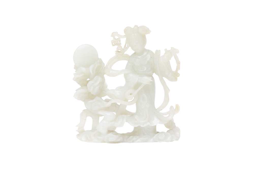 Lot 425 - A CHINESE PALE-CELADON JADE 'CHANG'E AND RABBIT' GROUP