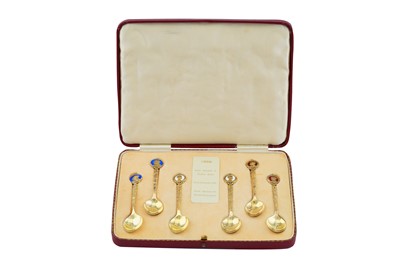 Lot 36 - A CASED SET OF SIX GEORGE VI STERLING SILVER GILT AND ENAMEL ROYAL COMMEMORATIVE TEASPOONS, BIRMINGHAM 1936 BY WILLIAM HAIR HASSLER