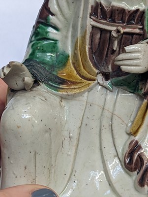 Lot 138 - A CHINESE SANCAI-GLAZED FIGURE OF GUANYIN