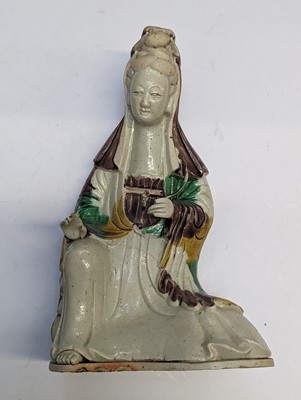 Lot 138 - A CHINESE SANCAI-GLAZED FIGURE OF GUANYIN