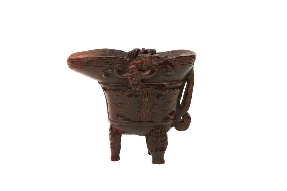 Lot 178 - λ A CHINESE CARVED YAK HORN LIBATION CUP