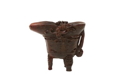 Lot 588 - λ A CHINESE CARVED YAK HORN LIBATION CUP