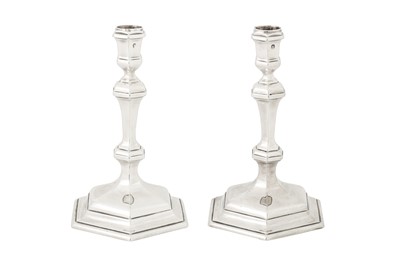 Lot 461 - A pair of George I Britannia standard silver candlesticks, London 1718 by William Lukin I (reg. 31st July 1699)