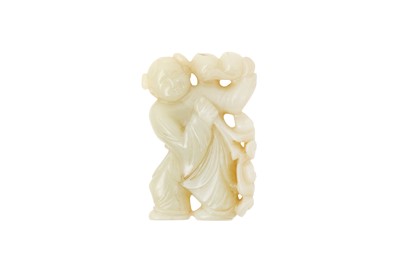 Lot 848 - A CHINESE CELADON JADE CARVING OF A BOY HOLDING PEACHES