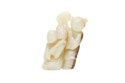 Lot 209 - A CHINESE CELADON AND RUSSET JADE 'BOYS AND LINGZHI' CARVING