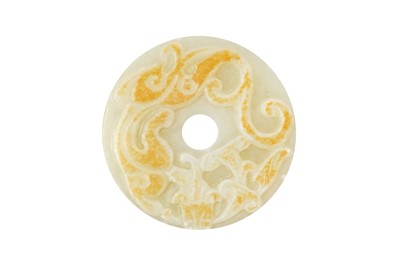 Lot 841 - A CHINESE CELADON AND RUSSET JADE ARCHAISTIC 'CHILONG' DISC, BI