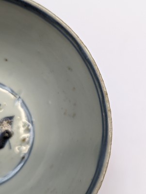 Lot 28 - A PAIR OF CHINESE BLUE AND WHITE 'BIRD AND PEACH' BOWLS