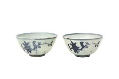 Lot 623 - A PAIR OF CHINESE BLUE AND WHITE 'BIRD AND PEACH' BOWLS