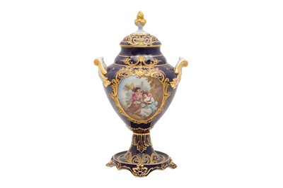 Lot 136 - A 20TH CENTURY SEVRES STYLE URN AND COVER