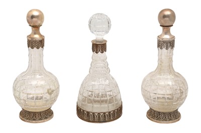 Lot 185 - A GROUP OF THREE CUT GLASS SILVER MOUNTED DECANTERS