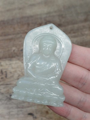 Lot 941 - A CHINESE PALE CELADON JADE 'BUDDHA' PLAQUE