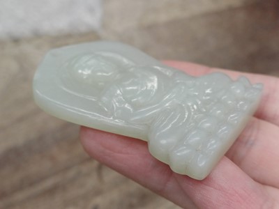 Lot 941 - A CHINESE PALE CELADON JADE 'BUDDHA' PLAQUE