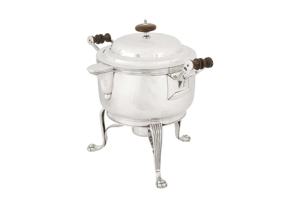 Lot 107 - An early 19th century Indian colonial silver curry and milk pan upon burner stand, Calcutta circa 1830 by Hamilton and Co