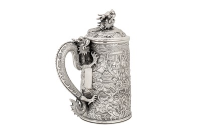 Lot 161 - A large late 19th century Chinese Export silver lidded mug or tankard, Canton circa 1880 by Qiu Ji, retailed by Lee Ching of Canton and later Hong Kong