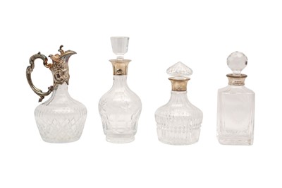Lot 194 - THREE CONTEMPORARY CRYSTAL DECANTERS WITH HALLMARKED STERLING SILVER COLLARS