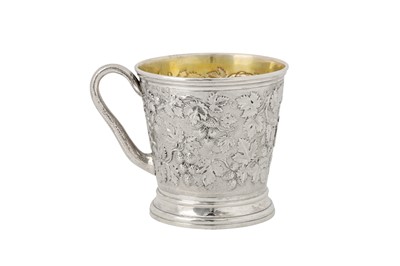 Lot 337 - A Victorian sterling silver ‘fruiting vine’ mug, London 1850 by John Samuel Hunt