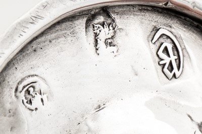 Lot 468 - A Queen Anne Britannia standard silver miniature or ‘toy’ chamberstick, London 1712 by George Manjoy
