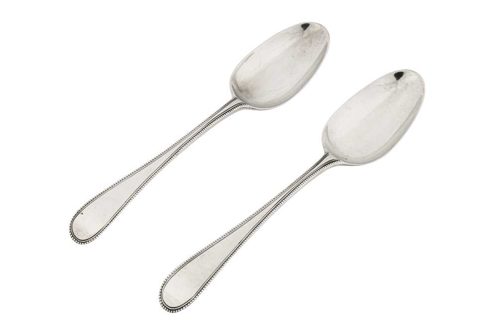 Lot 225 - A very rare pair of George III sterling silver tablespoons, London 1771 by Christopher Fly Woods and Thomas Filkin