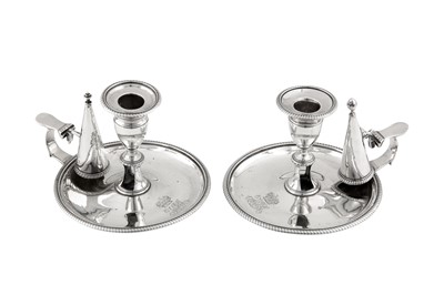 Lot 374 - Duchess of St Albans – A pair of George III sterling silver chambersticks, London 1814 by Charles Price