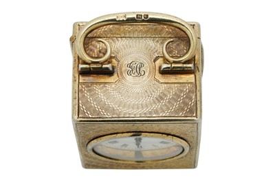 Lot 69 - An Edwardian sterling silver gilt cased travelling time piece or carriage clock, London 1909 by Drew and Sons