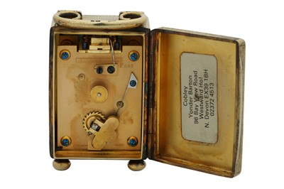 Lot 69 - An Edwardian sterling silver gilt cased travelling time piece or carriage clock, London 1909 by Drew and Sons