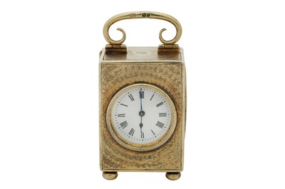 Lot 69 - An Edwardian sterling silver gilt cased travelling time piece or carriage clock, London 1909 by Drew and Sons