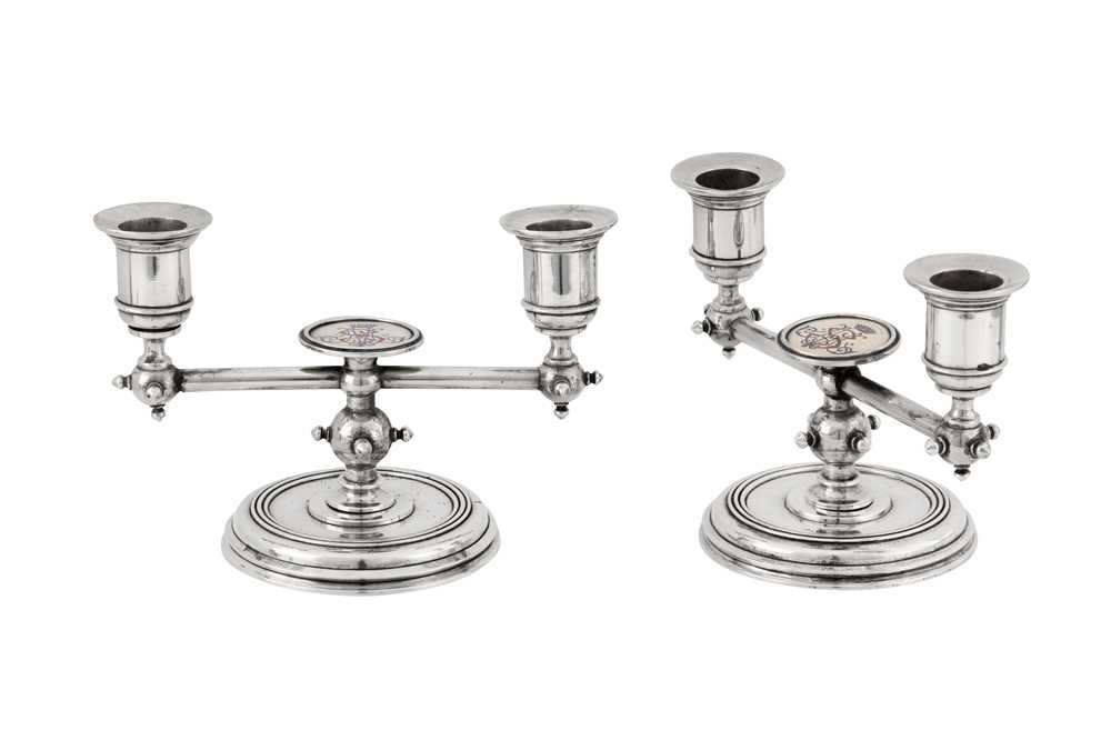 Lot 185 - A pair of Alexander III late 19th century Russian 84 zolotnik silver and enamel twin candlesticks, Saint Petersburg circa 1886 by Friedrich Emil Henrichsen