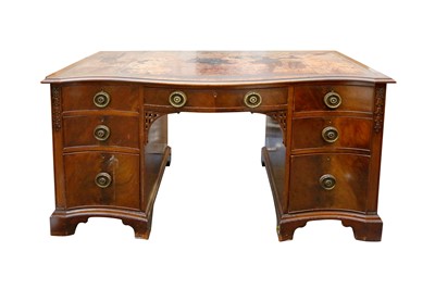 Lot 348 - AN EDWARDIAN WARING & GILLOW CHIPPENDALE STYLE MAHOGANY SERPENTINE FRONTED DESK