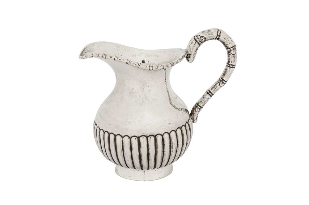 Lot 145 - An early 20th century Chinese Export silver milk or cream jug, Canton circa 1920 by Da Ji, retailed by Wang Hing