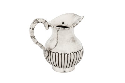 Lot 145 - An early 20th century Chinese Export silver milk or cream jug, Canton circa 1920 by Da Ji, retailed by Wang Hing