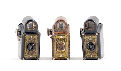 Lot 214 - Two Black & a Mottled Brown Coronet Midget Cameras.