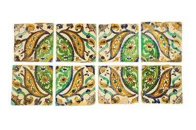 Lot 234 - EIGHT TUNISIAN QALLALIN POTTERY TILES WITH FLOWERS AND FOLIAGE