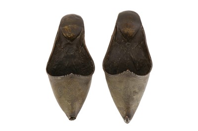 Lot 398 - A PAIR OF DECORATIVE QAJAR METAL SLIPPERS