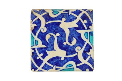 Lot 855 - AN INDIAN POTTERY TILE WITH VEGETAL MEANDERS
