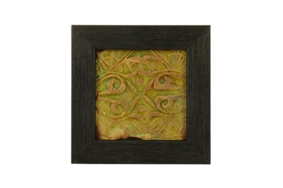 Lot 202 - A SMALL MOULDED OLIVE GREEN-GLAZED POTTERY TILE