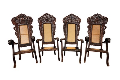 Lot 510 - TWO PAIRS OF INDO-PORTUGUESE CARVED HARDWOOD PLANTATION ARMCHAIRS