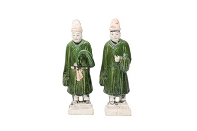 Lot 843 - A PAIR OF CHINESE GREEN-GLAZED POTTERY ATTENDANTS