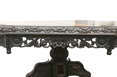 Lot 509 - AN IMPRESSIVE AND VERY LARGE ANGLO-INDIAN EBONY AND SPECIMEN WOOD-INLAID CENTRE TABLE
