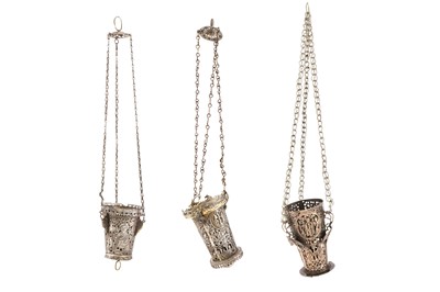Lot 292 - THREE WHITE METAL OPENWORK SANCTUARY LAMPS WITH CHRISTIAN ICONOGRAPHY AND SYMBOLS