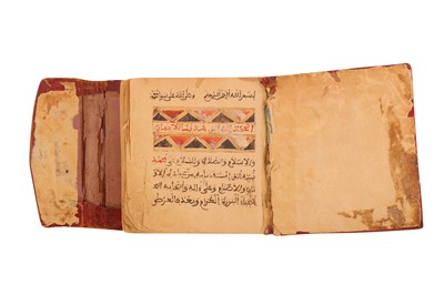 Lot 230 - THREE RELIGIOUS MANUSCRIPTS IN MAGHRIBI SCRIPT