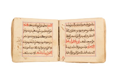 Lot 230 - THREE RELIGIOUS MANUSCRIPTS IN MAGHRIBI SCRIPT