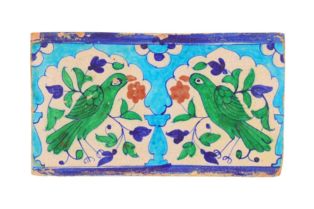 Lot 435 - A MULTAN POTTERY TILE WITH A PAIR OF GREEN PARAKEETS