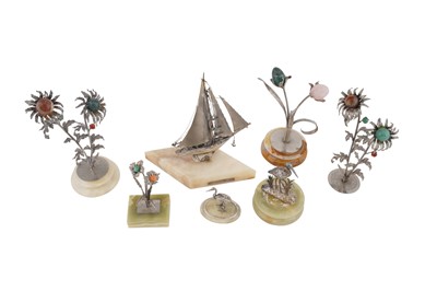 Lot 93 - A mixed group of silver flowers on stone stands