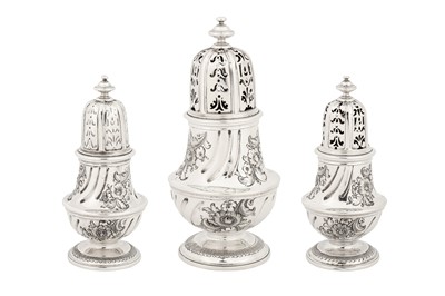 Lot 457 - A graduated set of three early George II sterling silver casters, London 1727 by George Wickes (reg. 3 Feb 1722)