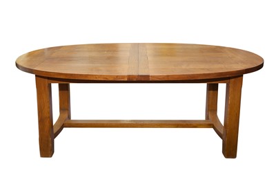 Lot 365 - A CONTEMPORARY OAK EXTENDING DINING TABLE AND CHAIRS