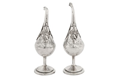 Lot 262 - A PAIR OF LATE 19TH/EARLY 20TH CENTURY EGYPTIAN OR LIBYAN SILVER ROSEWATER SPRINKLERS