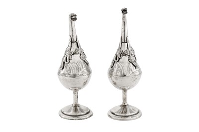 Lot 262 - A PAIR OF LATE 19TH/EARLY 20TH CENTURY EGYPTIAN OR LIBYAN SILVER ROSEWATER SPRINKLERS