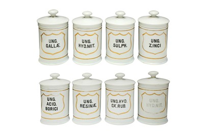 Lot 211 - A SET OF EIGHT EARLY 20TH CENTURY WHITE GLAZED CYLINDRICAL POTTERY JARS